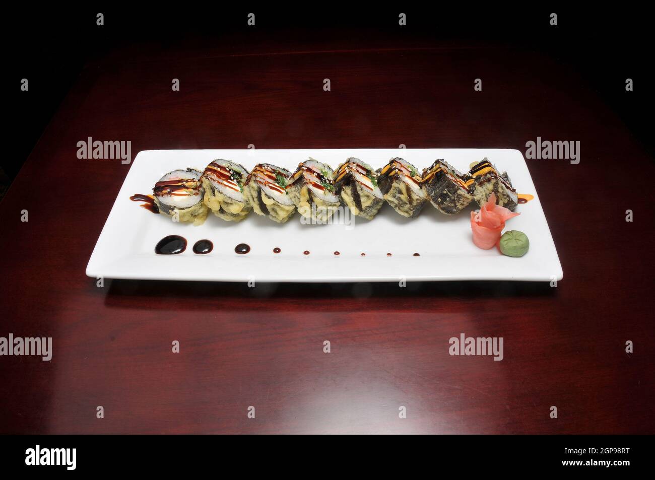 Traditional and authentic Japanese cusine know as a crunchy Sushi Roll Stock Photo
