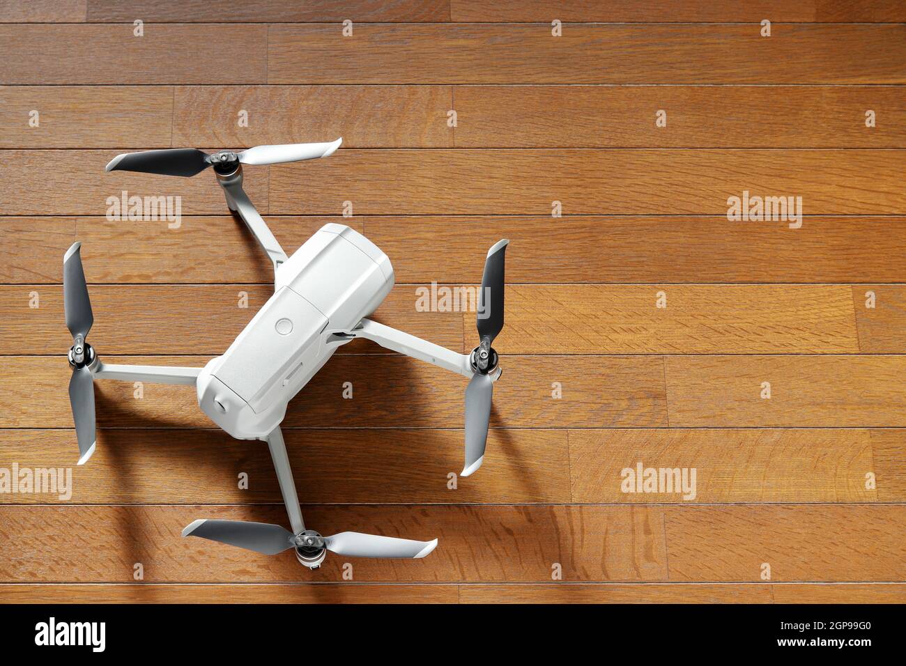 small drone copter on a wooden background Stock Photo