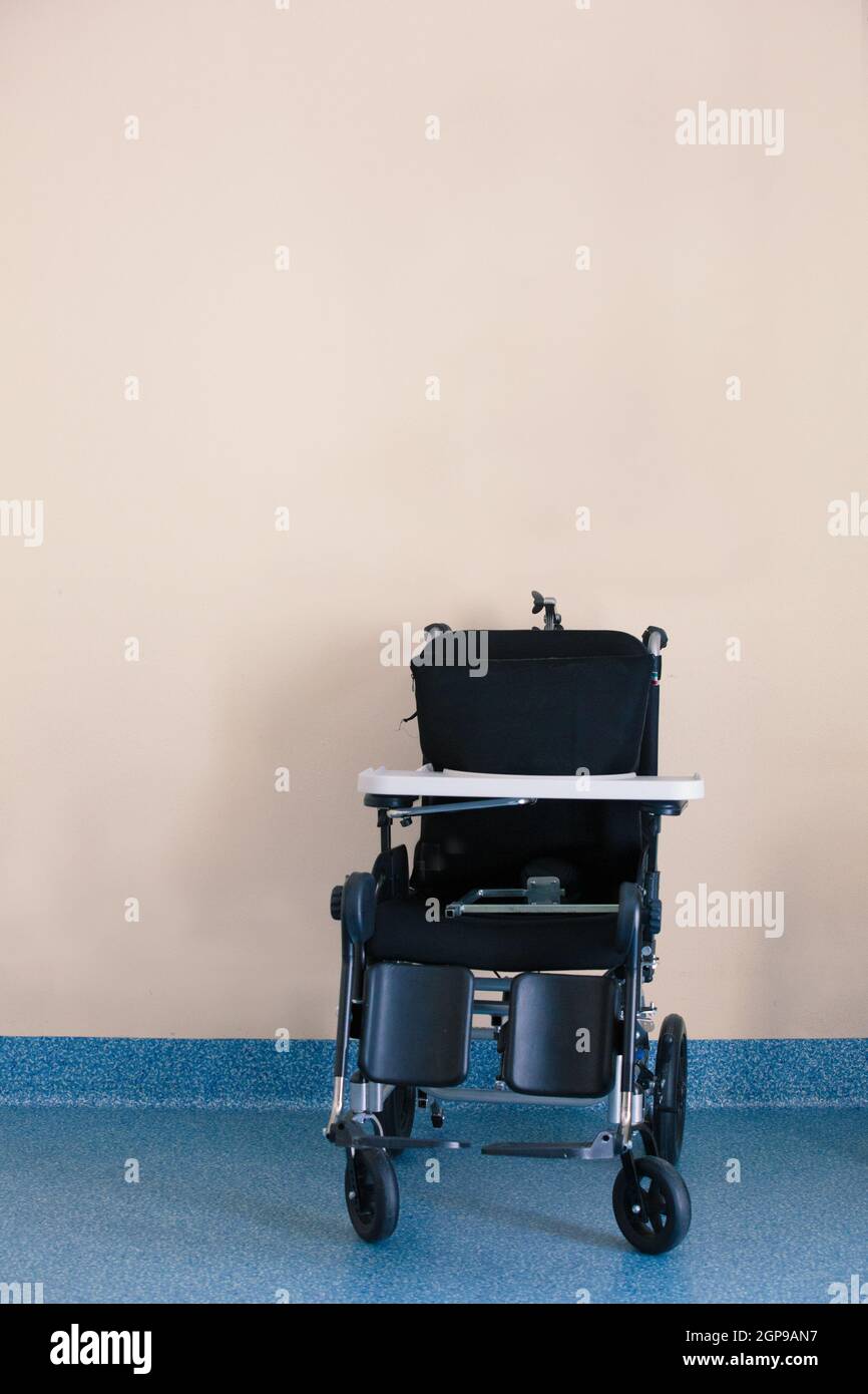 Black Invalid chair for disabled people parked in bright patients ...