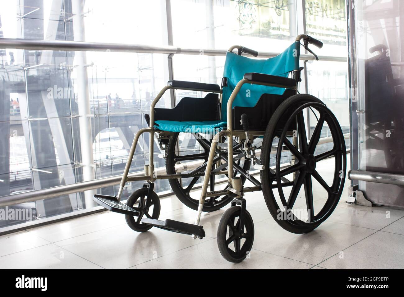 Wheelchair service in airport terminal Stock Photo Alamy