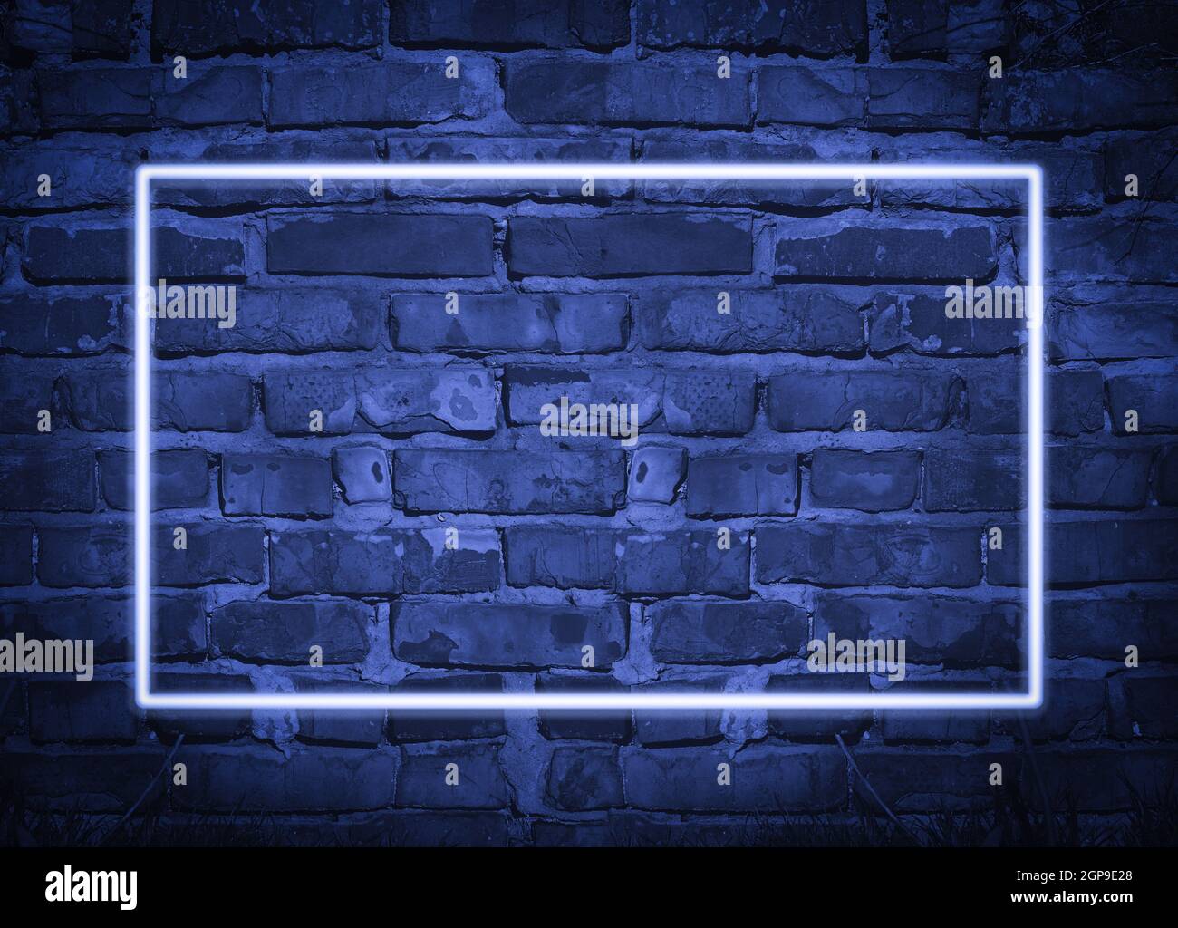 rectangular glowing blue neon frame on brick wall background, place for ...