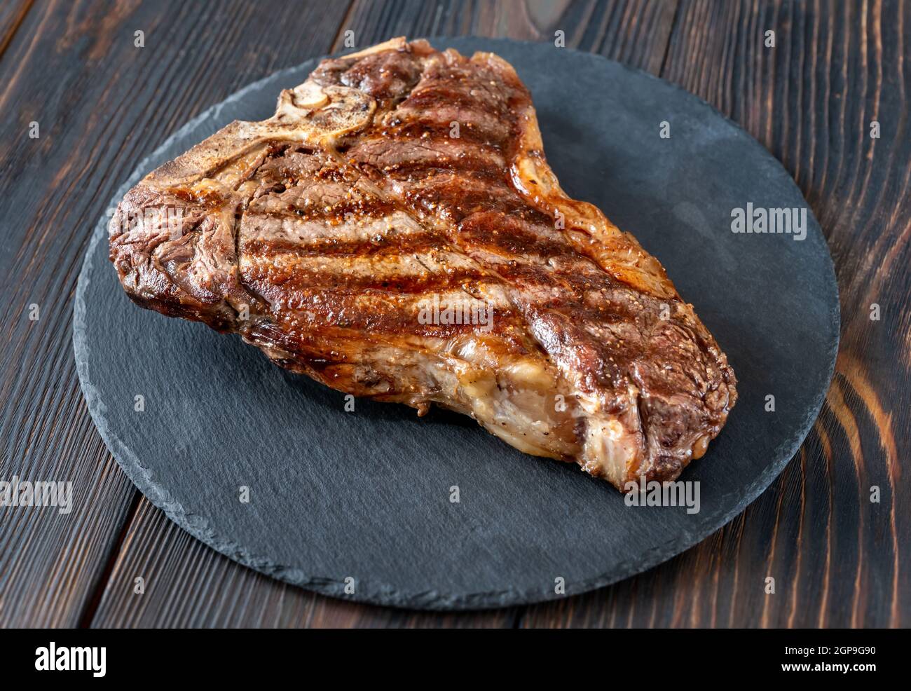 Grilled Tbone steak on the stone board Stock Photo Alamy