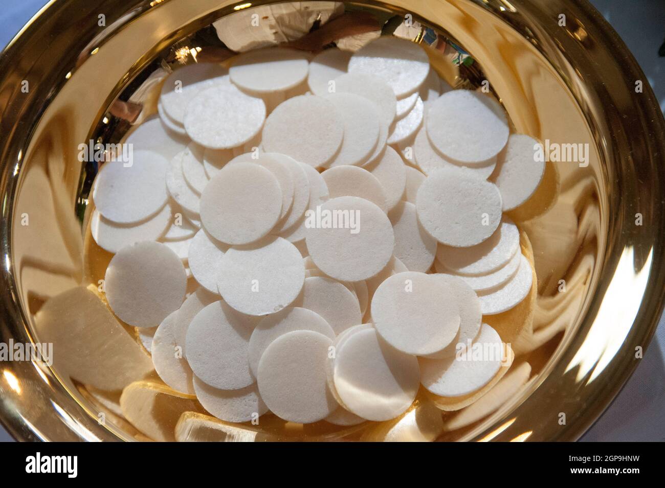 bowl with sacramental bread or host at the holy communion Stock Photo