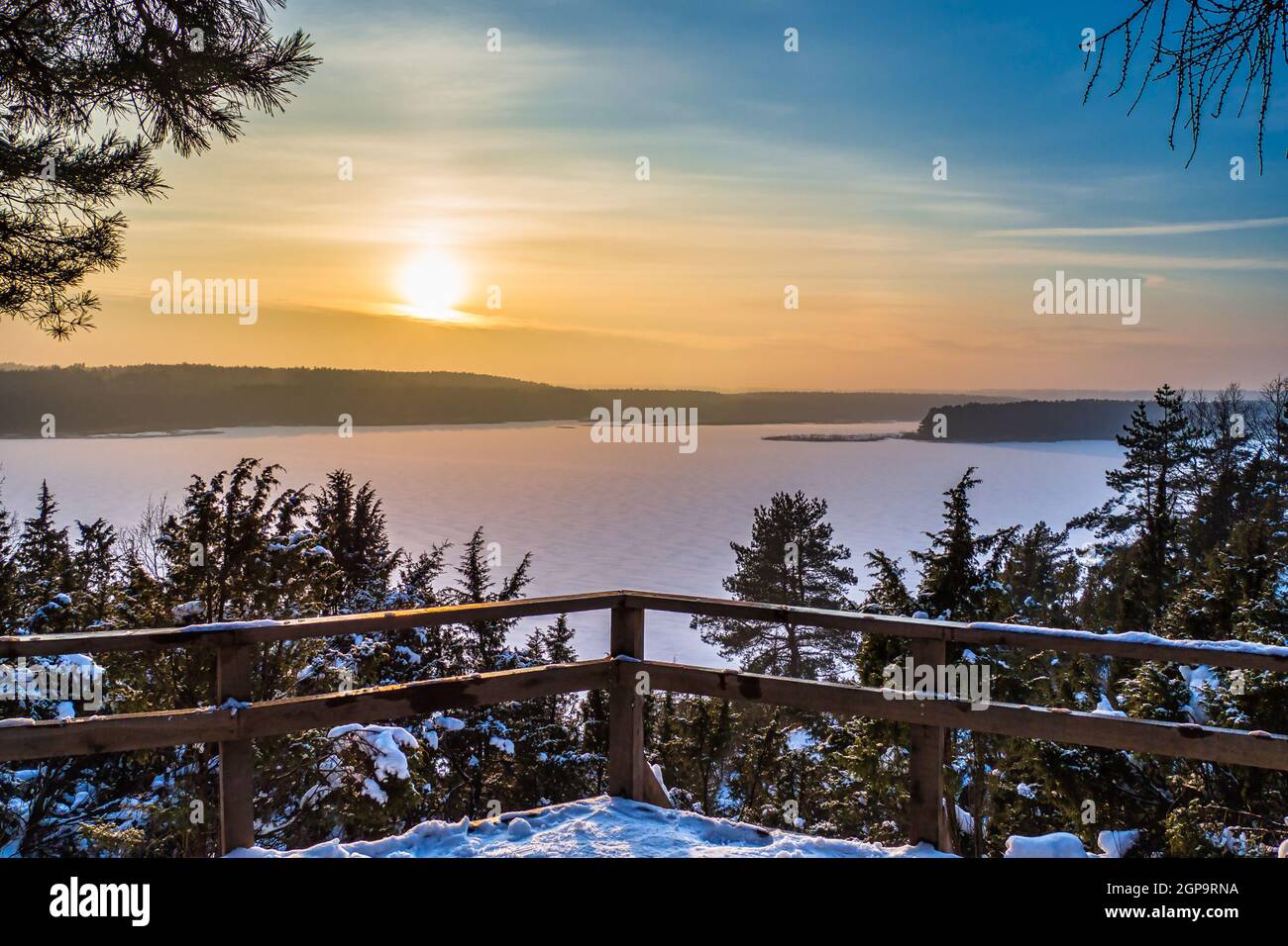Breathtaking Sunset with Golden Clouds over Frozen Lake Stock Photo - Alamy