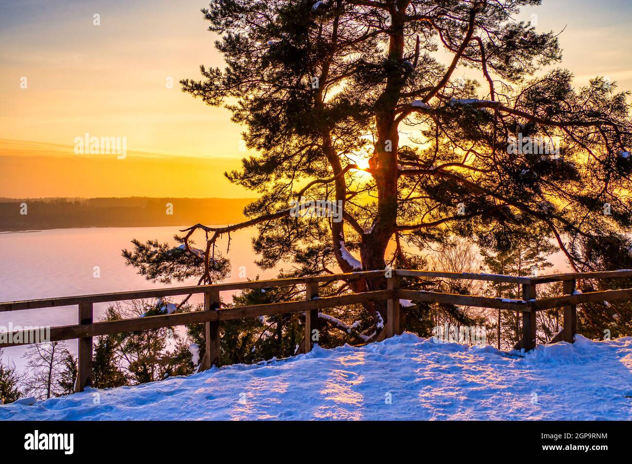 Winter Scene with Colorful Sunset over Frozen Lake Stock Photo - Alamy