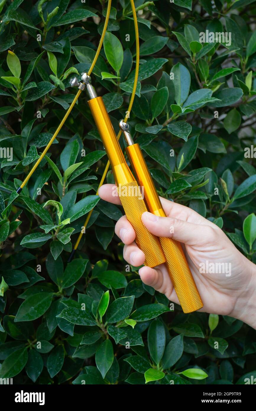 Hand of woman holding a speed jump rope, stock photo Stock Photo - Alamy