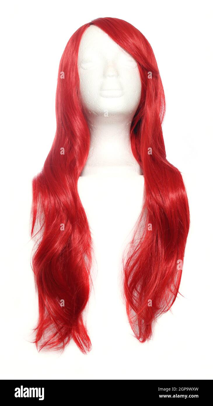 Red Anime Style Wig on mannequin head isolated on white background Stock Photo