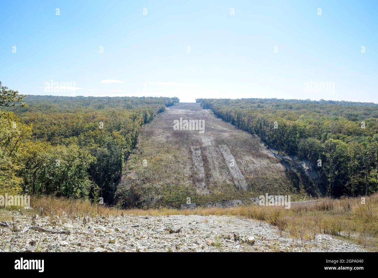 A clearing in the forest for the gas pipeline. Underground gas 