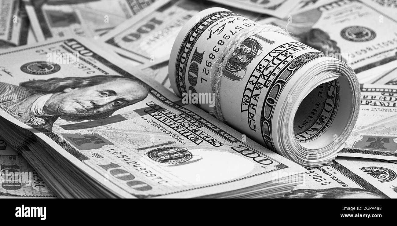 A hundred American banknotes are scattered. cash hundred-dollar bills, dollar background image. Stock Photo