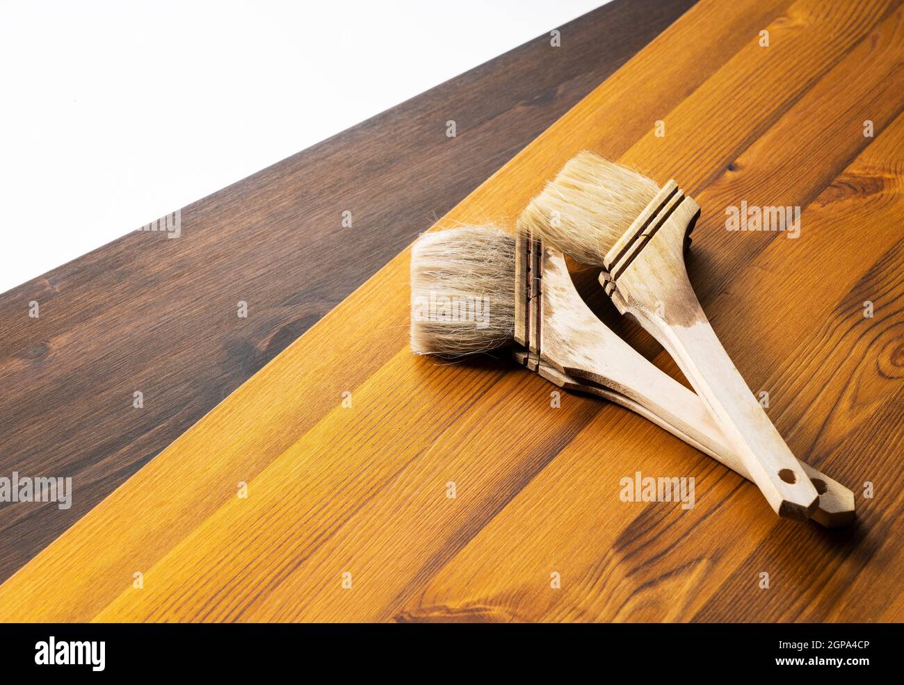 Oil stained wood boards and brushes. Picture of the painting Stock