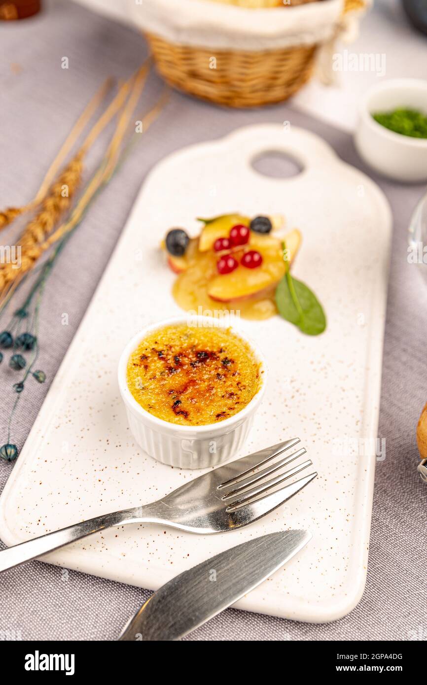 Goose liver pate with caramel crust served with wine jam Stock Photo