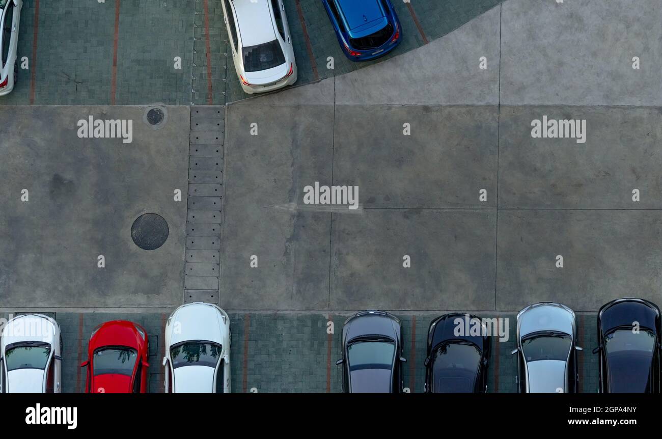 Top view concrete car parking lot. Aerial view of car parked at car