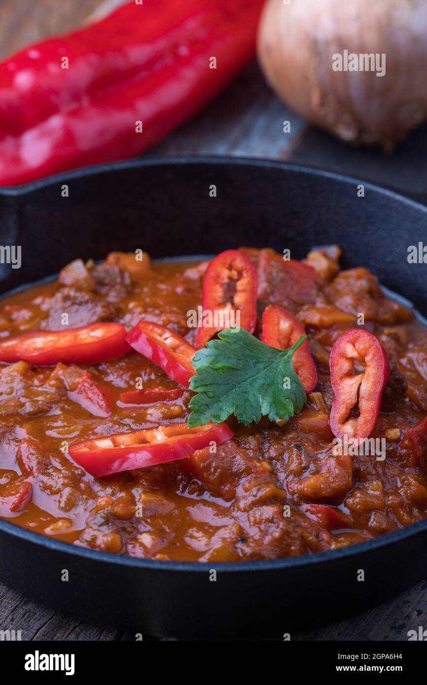hungarian goulash in an iron pan Stock Photo - Alamy