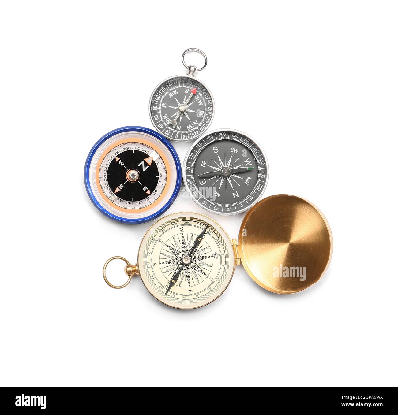 Different compasses on white background Stock Photo