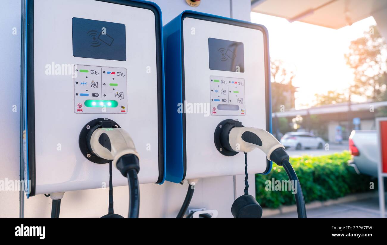 Electric car charging station for charge EV battery. Plug for vehicle with electric and hybrid engine. EV charger. Clean energy. Charging point for EV Stock Photo