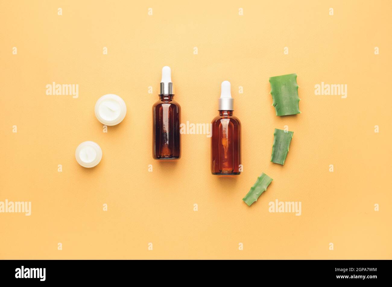 Different cosmetic products with aloe on color background Stock Photo ...