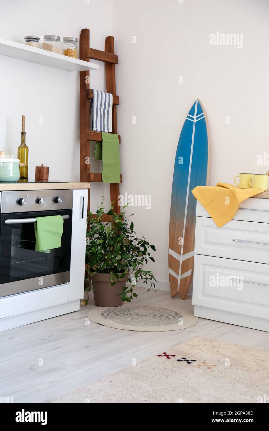 Interior of modern stylish kitchen with surfboard Stock Photo Alamy
