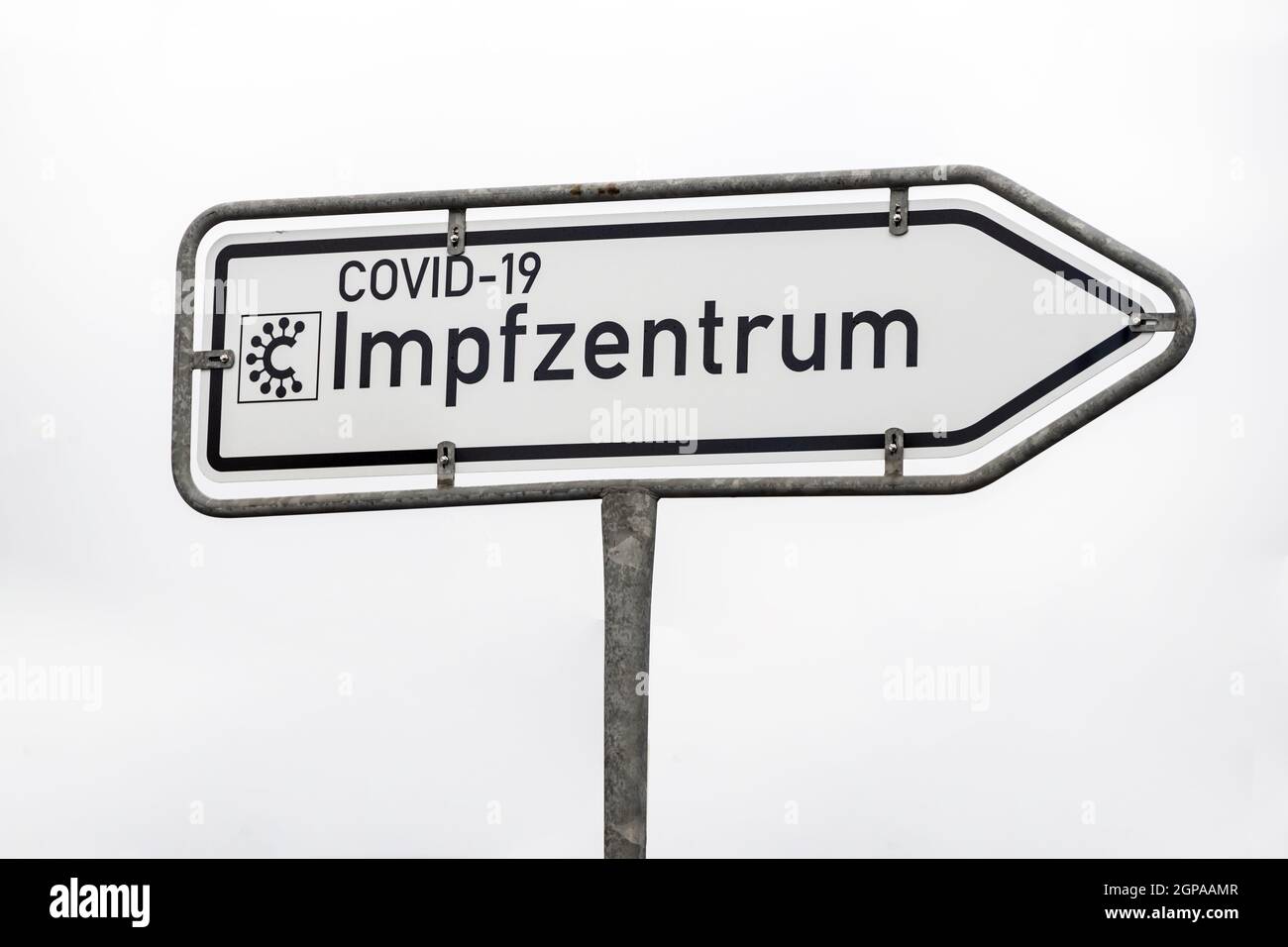 Street sign with german word for covid-19 vaccination center or center - vaccination center individually . Stock Photo