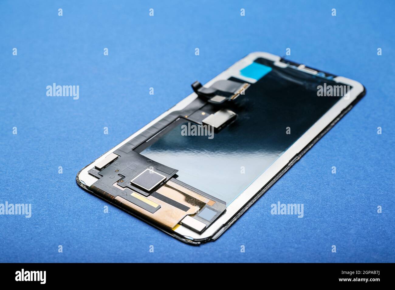 Mobile phone display module on blue background Stock Photo - Alamy
