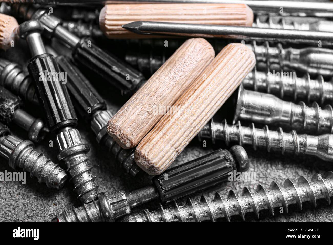 Dowels, different screws and nails on table, closeup Stock Photo