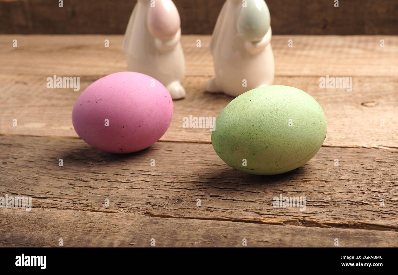 Naturally colored organic eggs on a rustic table with space for text, Easter background Stock Photo