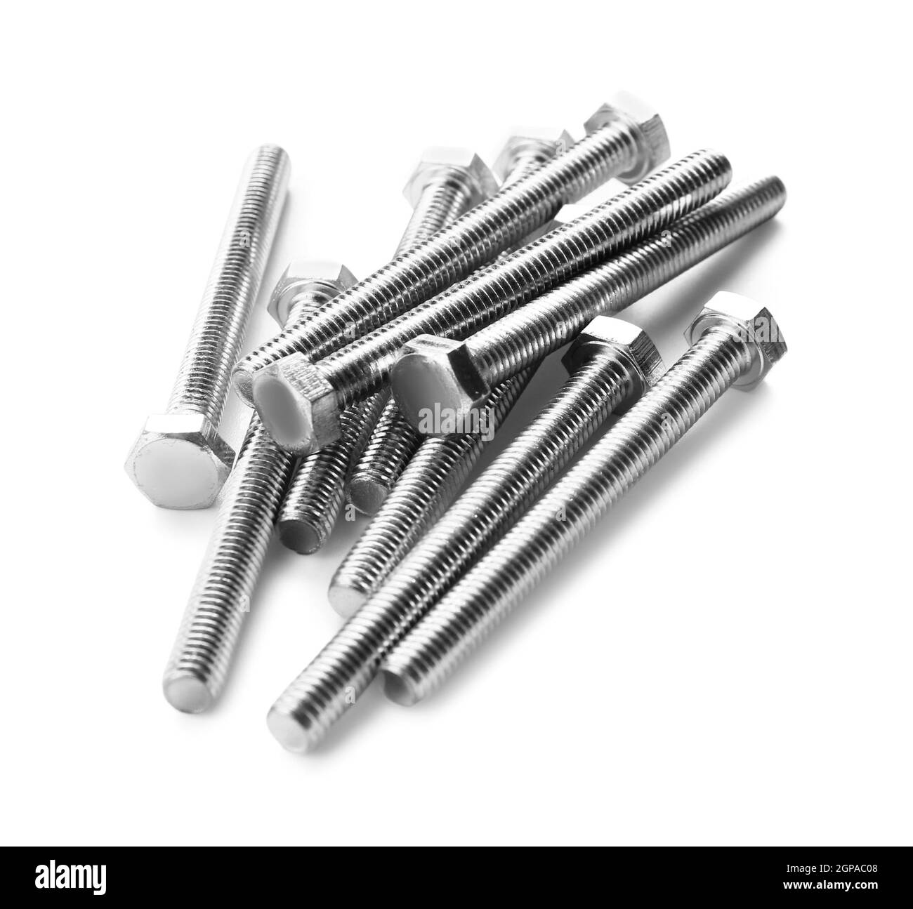 Pile of metal hex bolts on white background Stock Photo