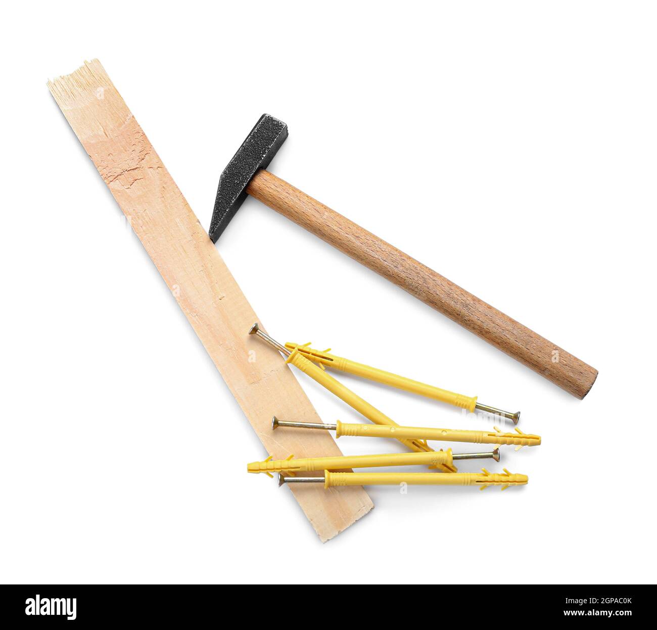 Wooden plank, hammer, screws and dowels on white background Stock Photo