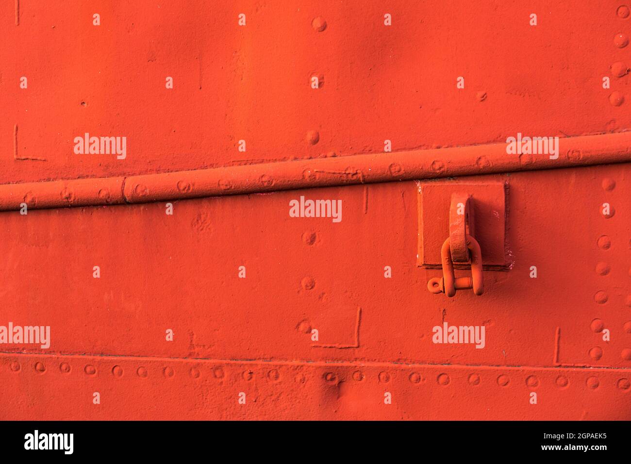 Grungy red texture, old surface of metal boat, abstract background. Stock Photo