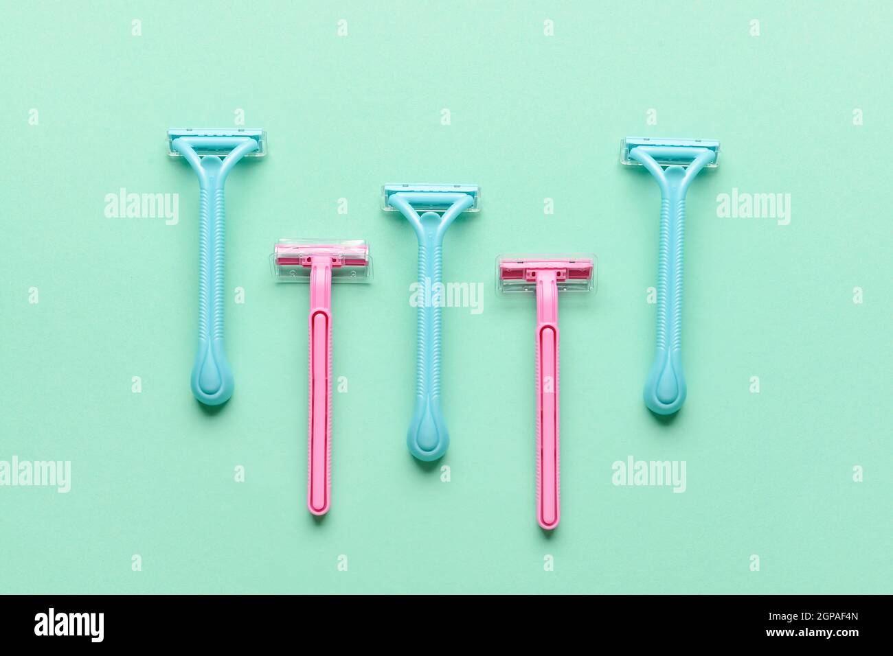 Many different razors for depilation on blue background Stock Photo