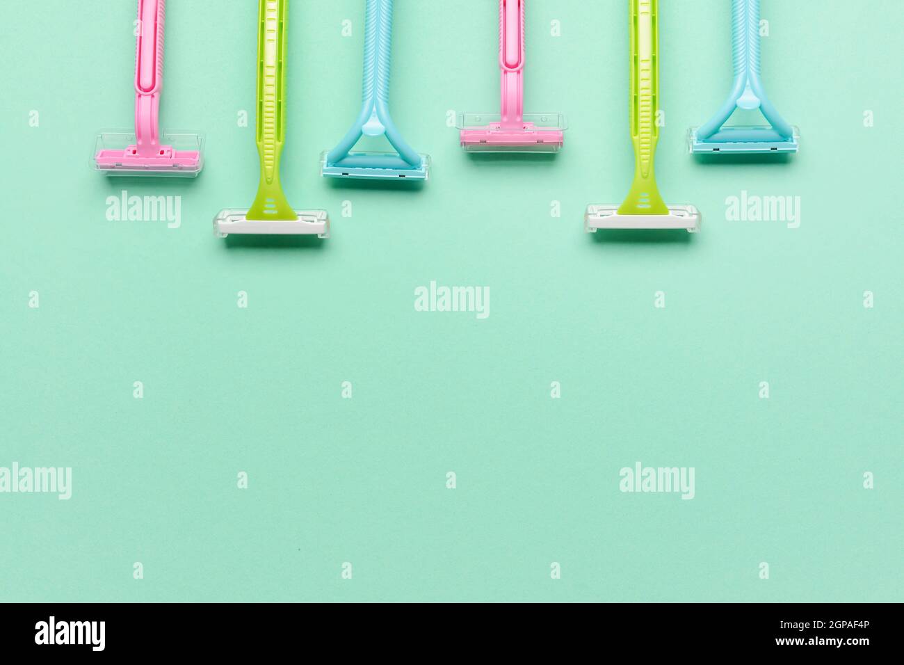 Many different razors for depilation on blue background, closeup Stock Photo