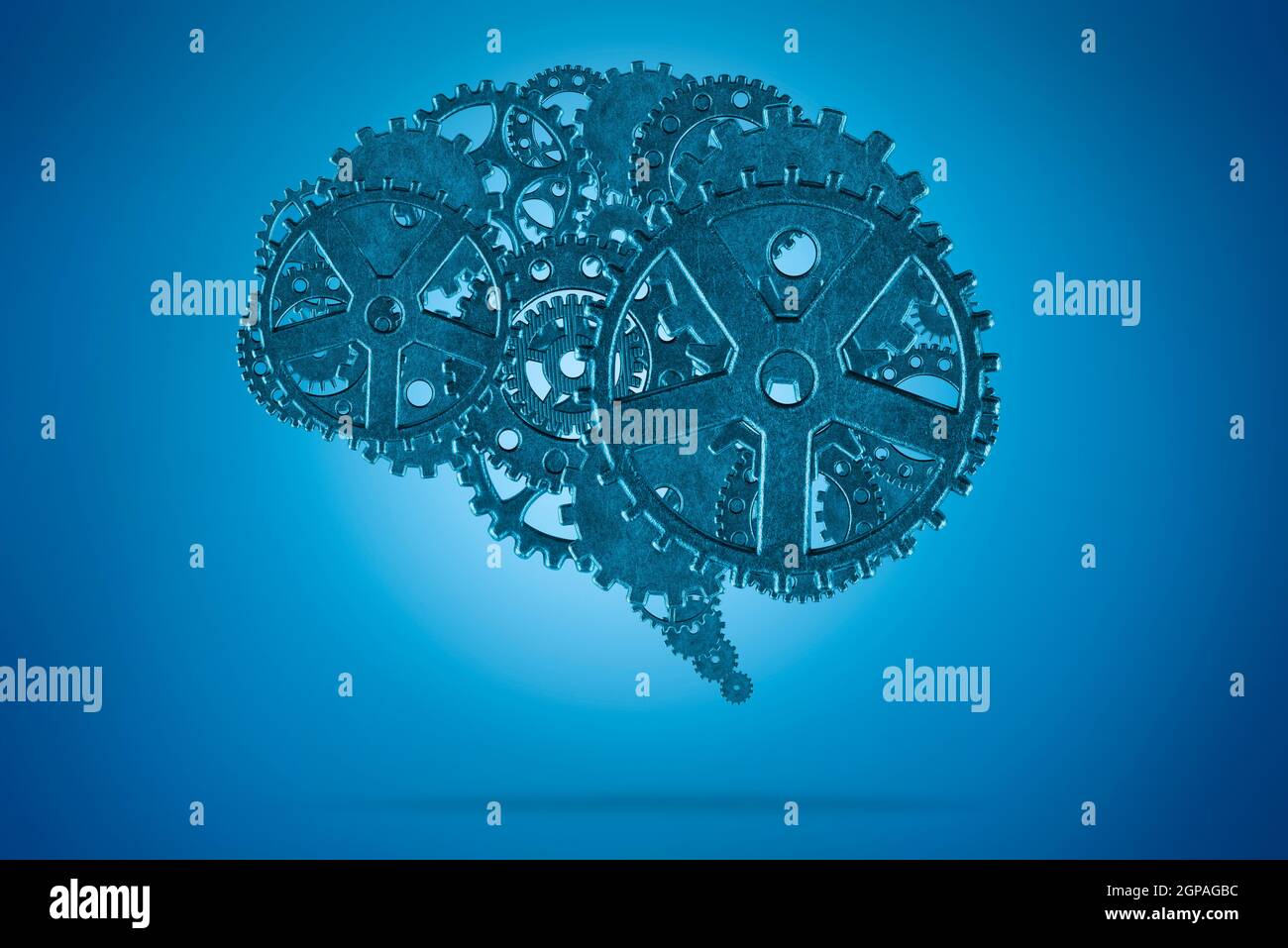 Human brain with metallic gears on blue background Stock Photo