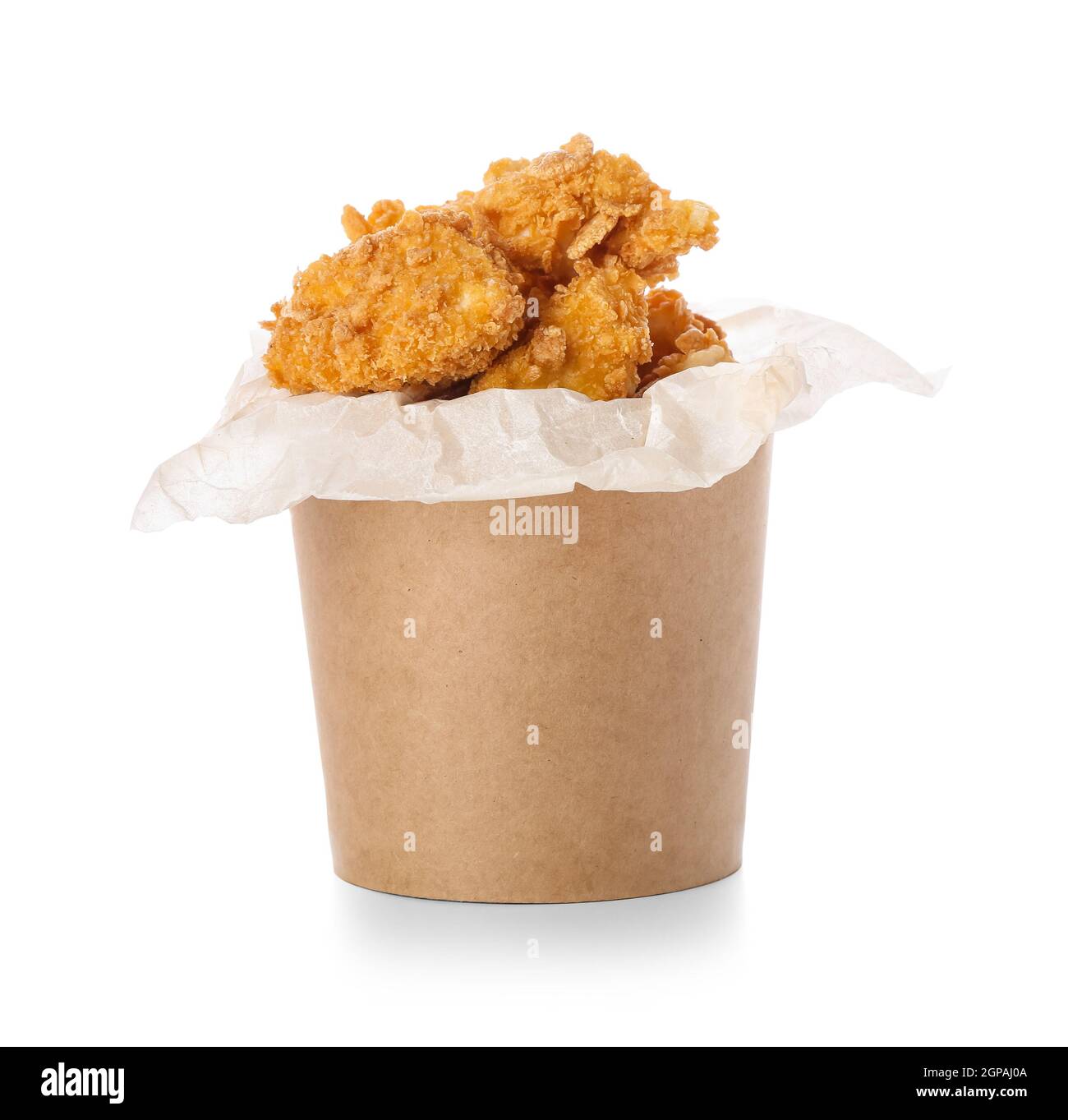 Paper bucket with tasty fried popcorn chicken on white background Stock Photo