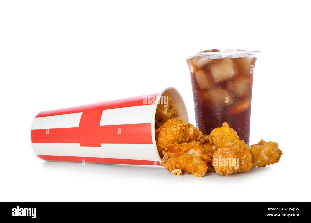 Paper bucket with tasty popcorn chicken and plastic cup of cola on white background Stock Photo