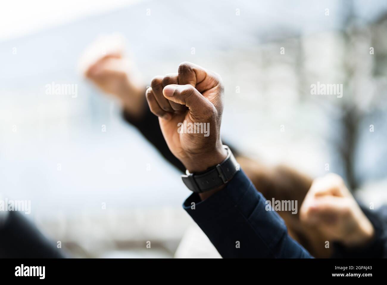 Raised First Protesting Raised Activist Fist At Demonstration March Stock Photo - Alamy