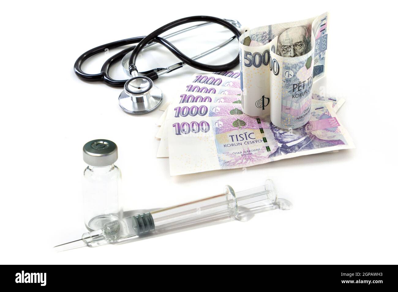 Czech paper money with heart on white background - stethoscope, heart, czech money 5000 and 1000, injection, syringe, vaccine, vaccination Stock Photo