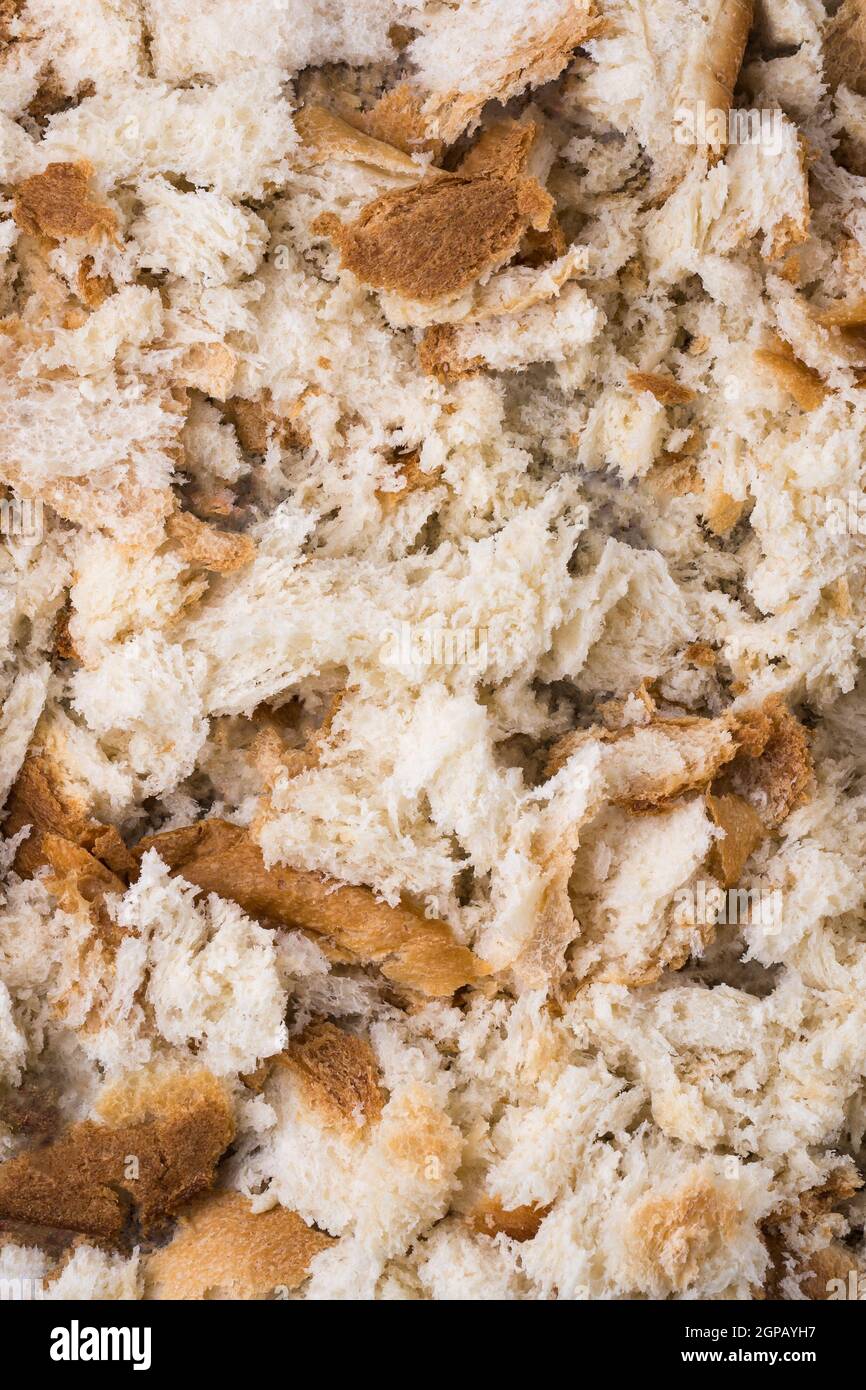 preparing bread crumbs, drying crumbled leftover bread pieces before it powdered to use as a coating for crispy fried food, food background, texture Stock Photo