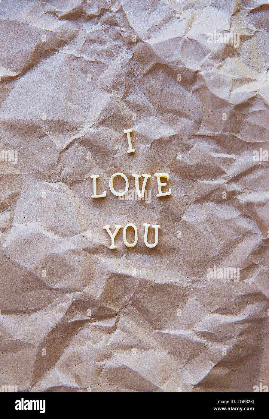 I love you written on kraft paper. valentine card Stock Photo - Alamy