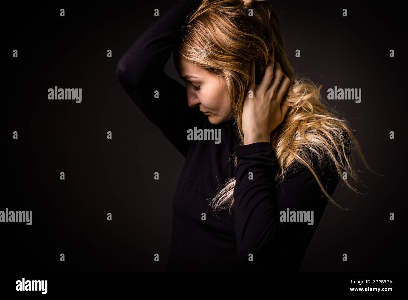 Lonely young woman standing hi-res stock photography and images - Alamy