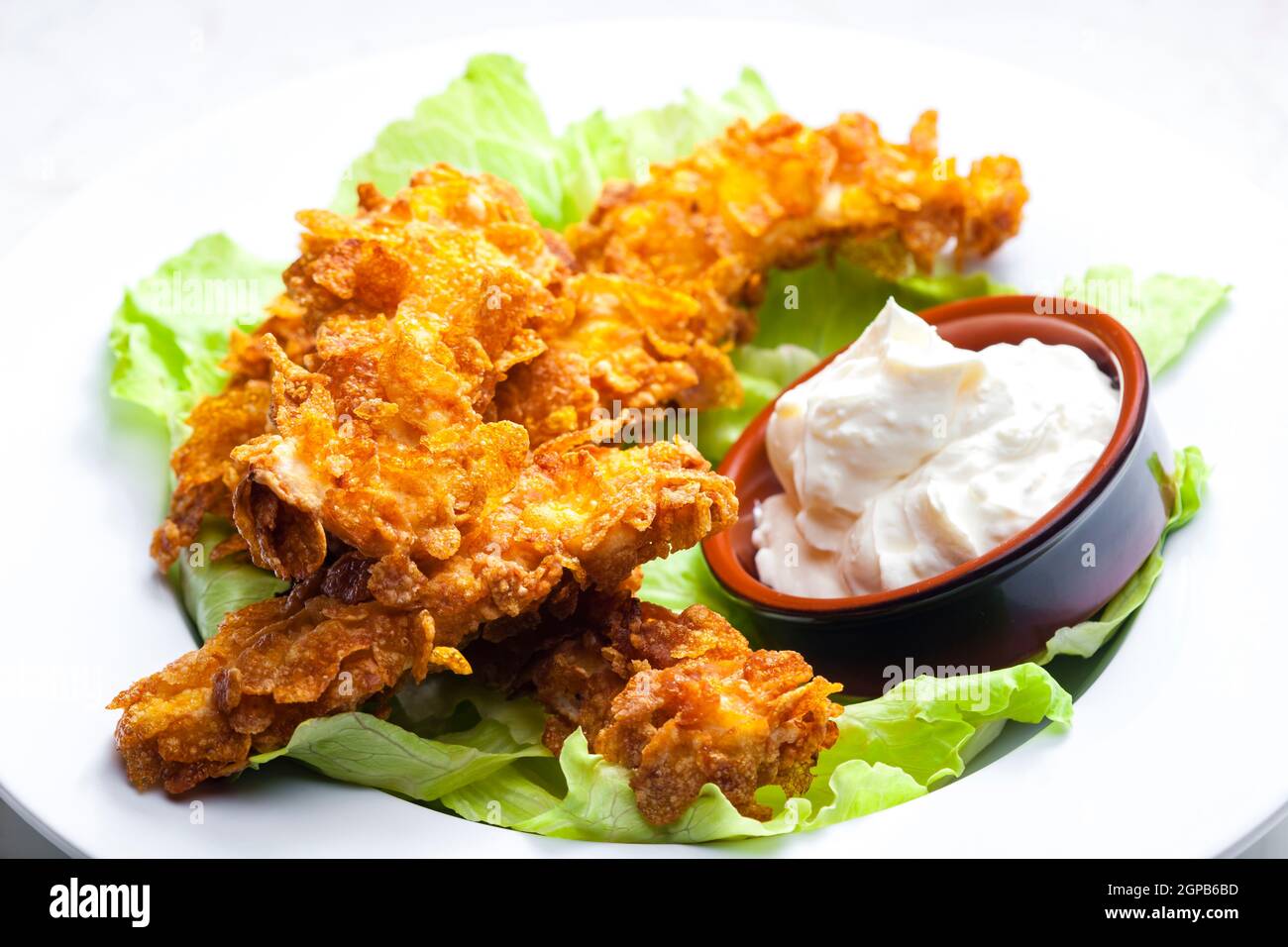 homemade chicken strips with garlic dip Stock Photo - Alamy