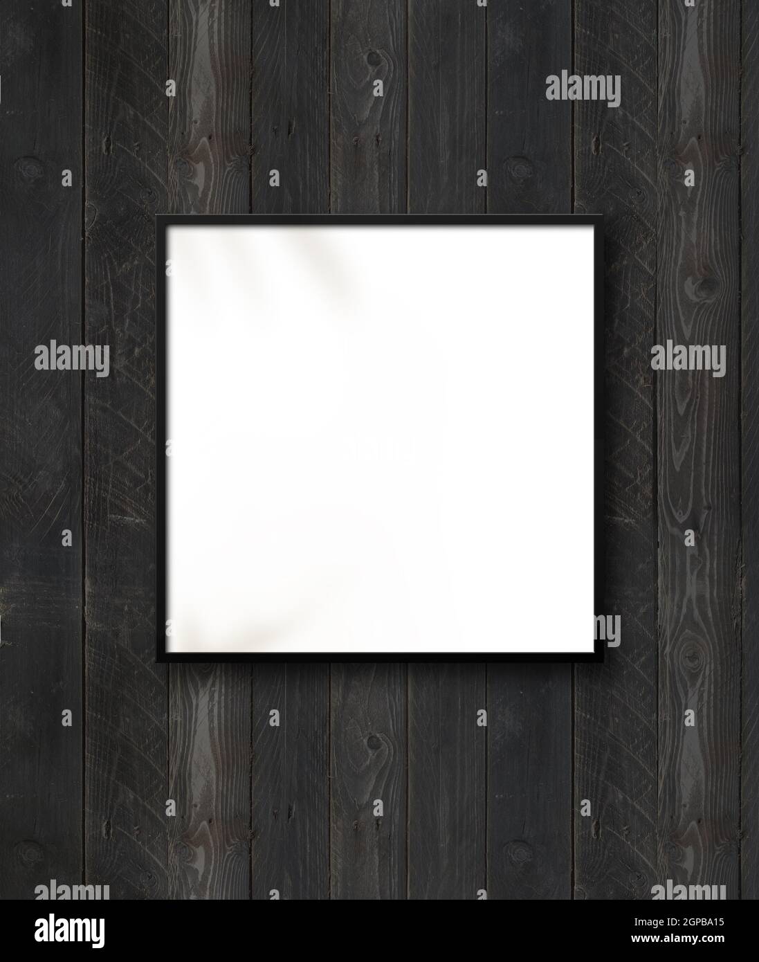 Black square picture frame hanging on a black wooden wall. Blank mockup ...