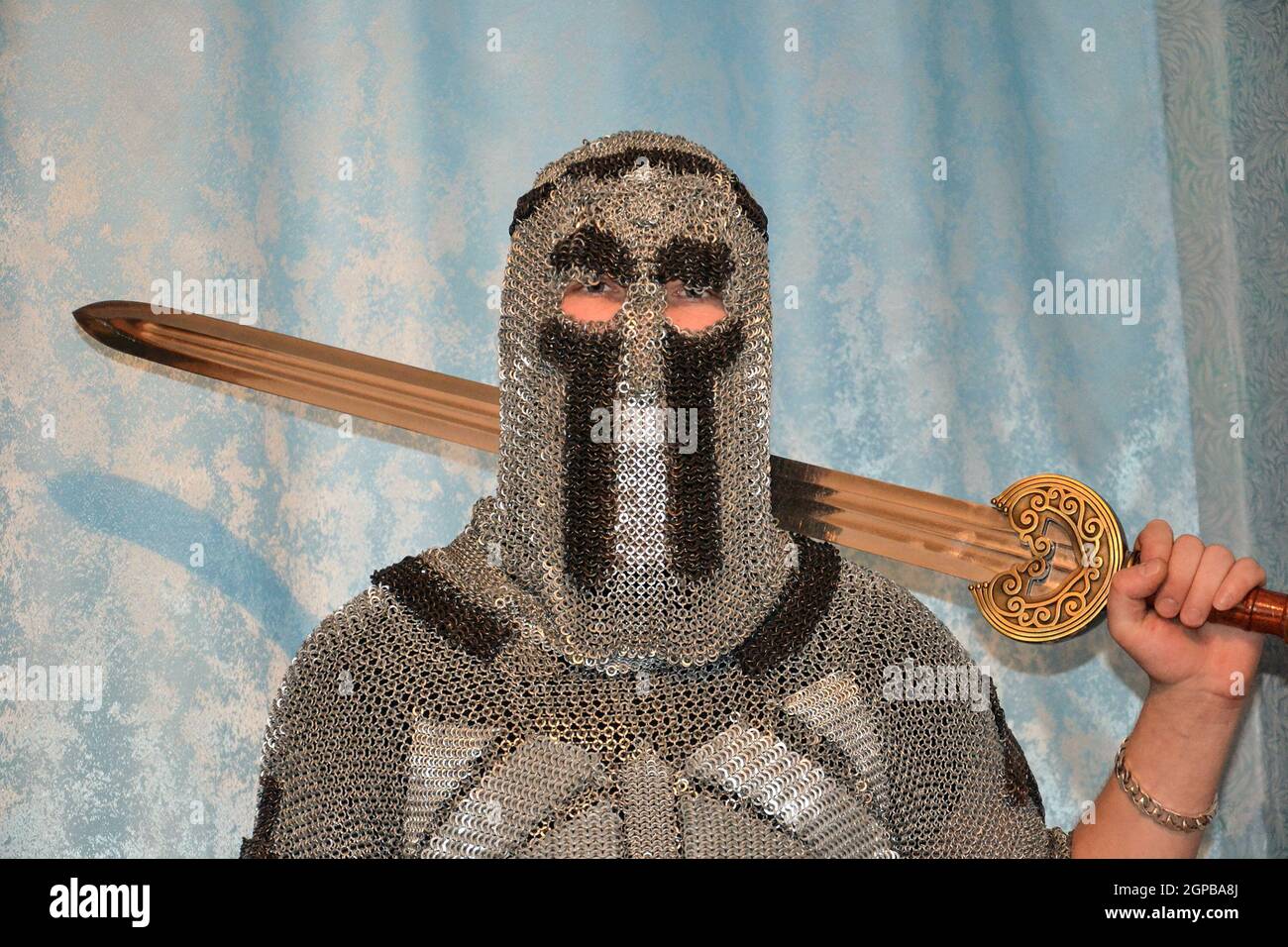 Knightly chain armor and sword. Fitting of a knightly armor Stock Photo