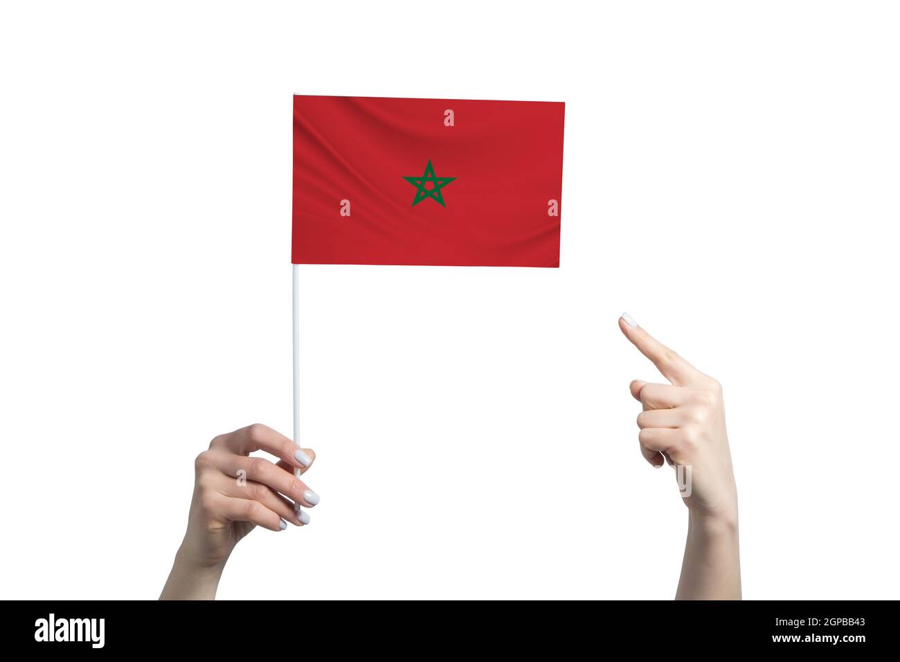 A beautiful female hand holds a Morocco flag to which she shows the finger  of her other hand, isolated on white background Stock Photo - Alamy