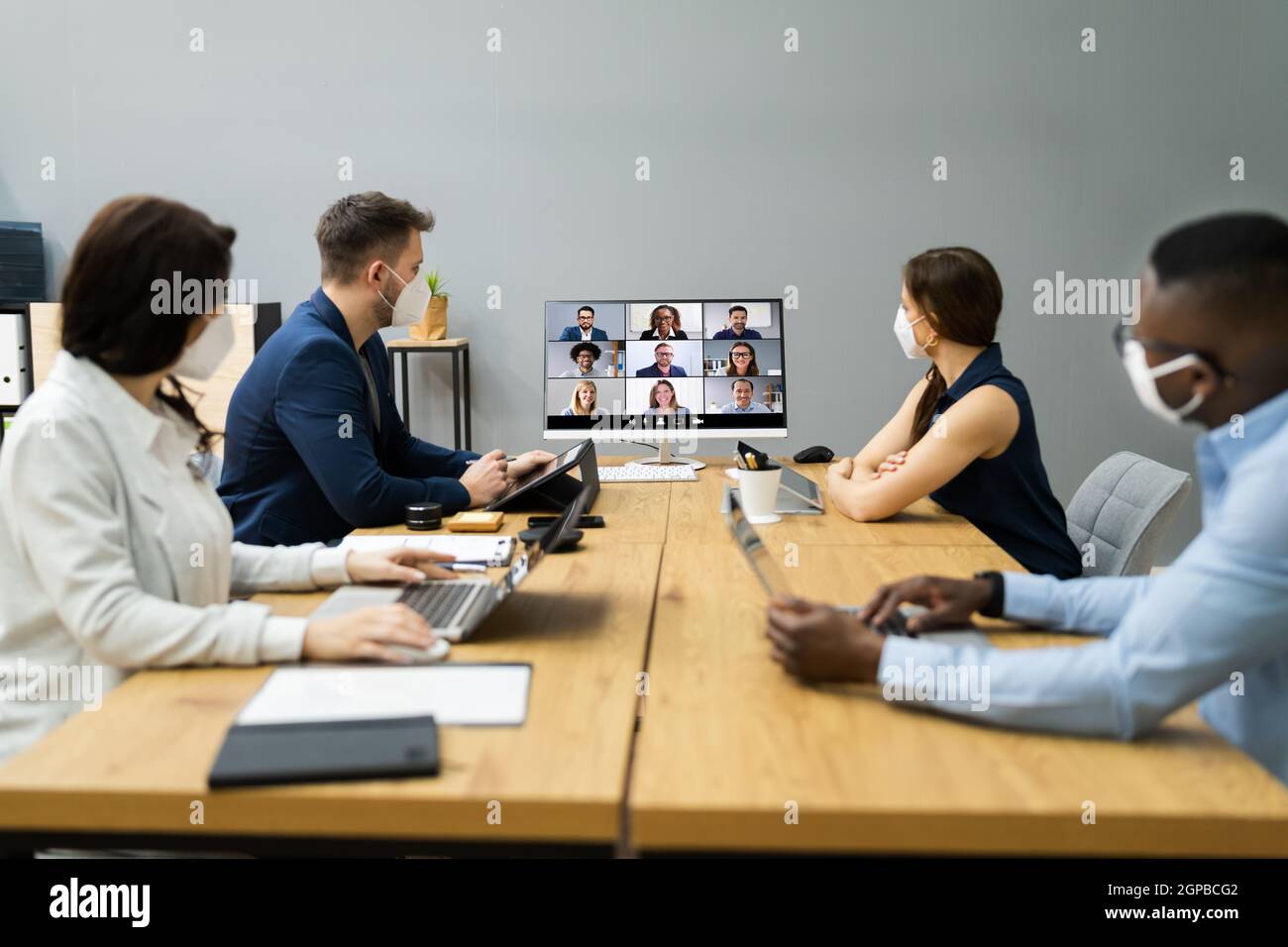 Video Conference Call At Business Meeting. Group Conferencing Stock
