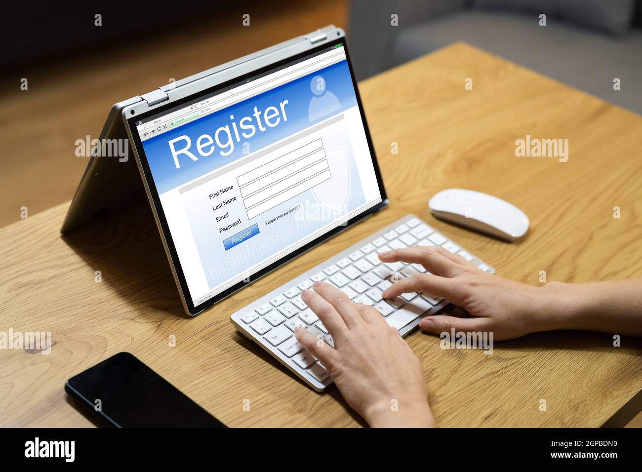 Filling Registration Web Form On Laptop Computer Stock Photo - Alamy