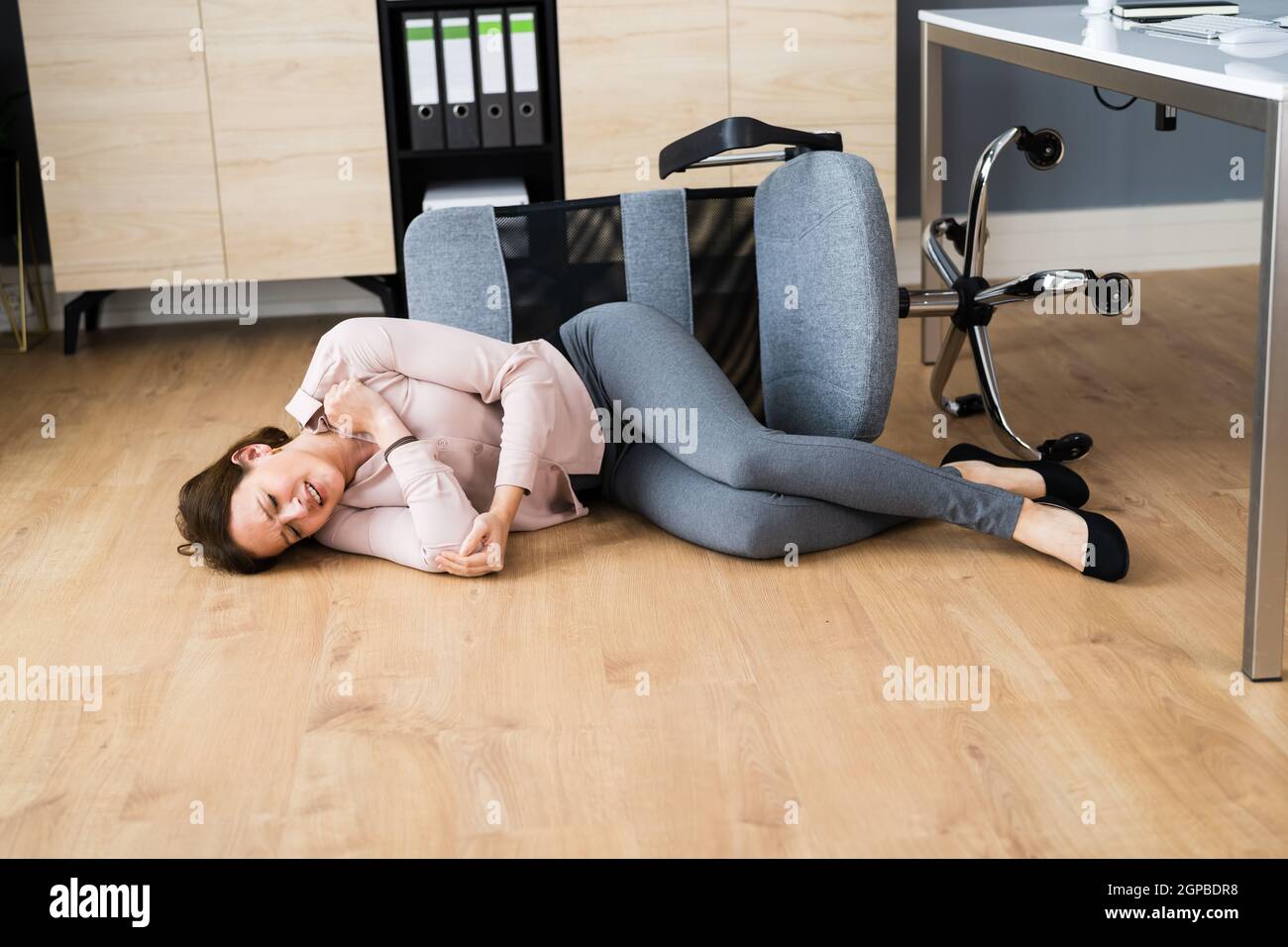 Slip Fall Office Chair Accident At Workplace Stock Photo Alamy