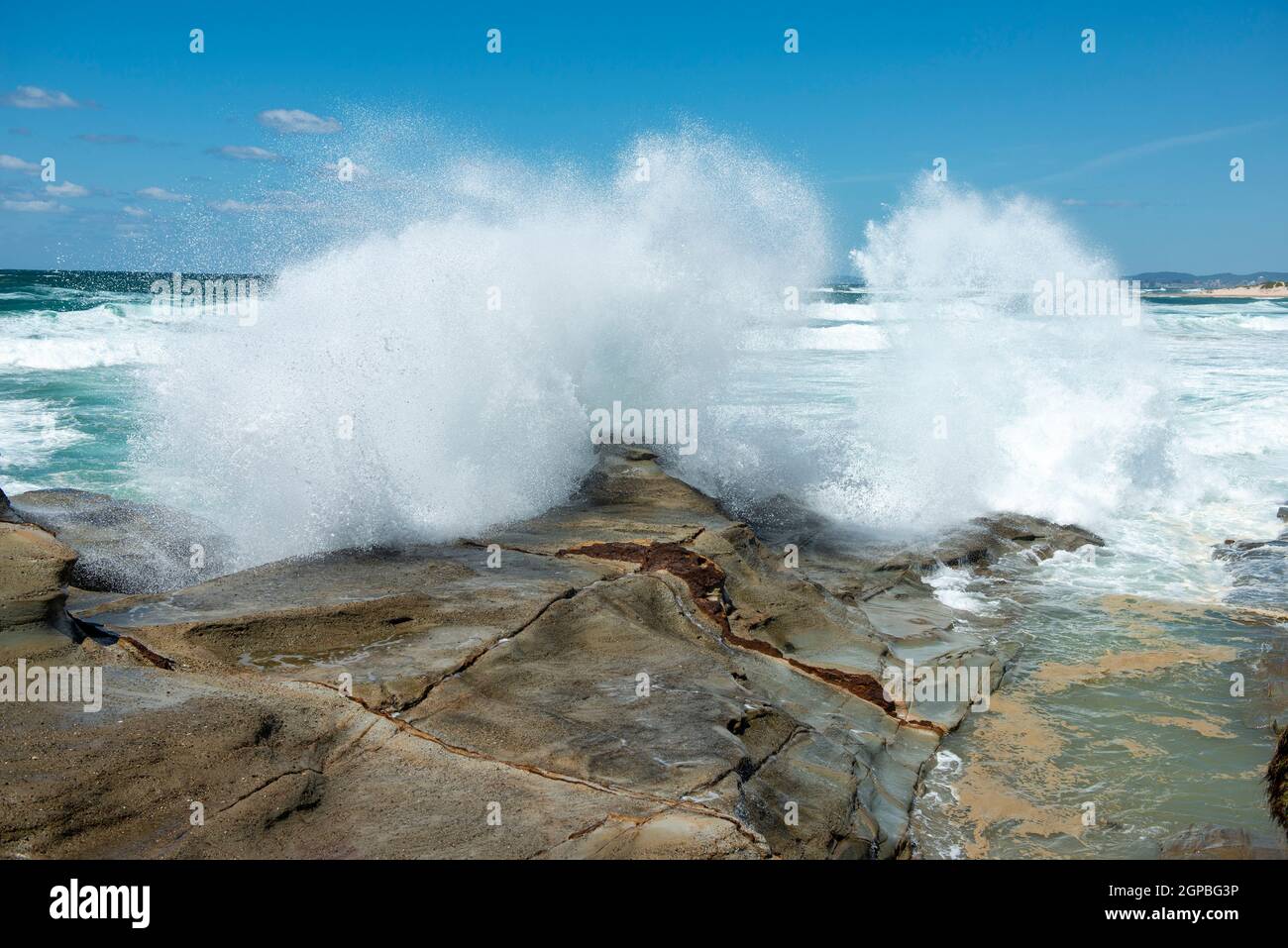 Waves breaking on rocks along the north coast of New South Wales, Australia. Stock Photo