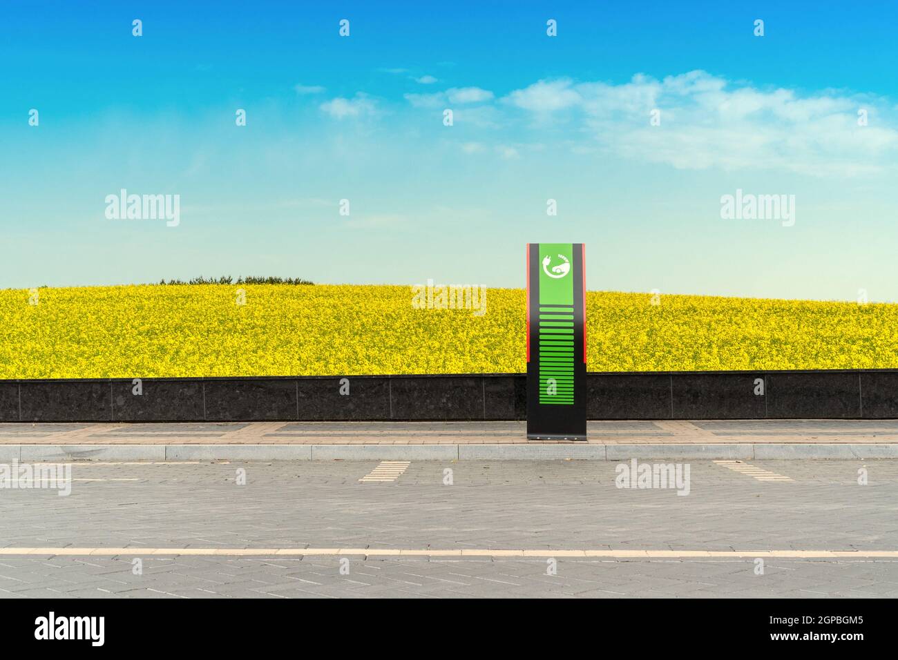 Electric car charging station with landscape background. Ecology and environment Stock Photo