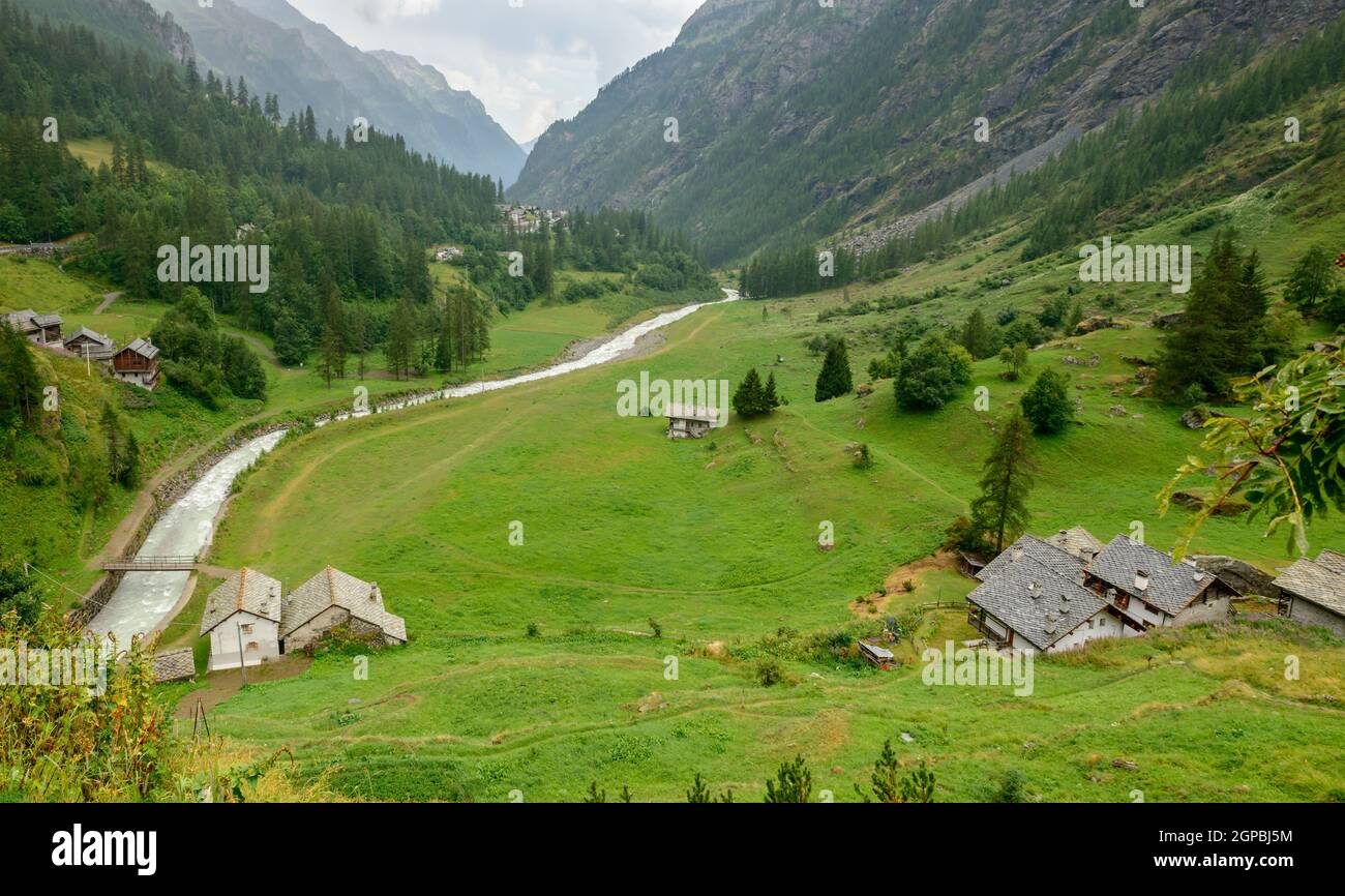 landscape of green river Lys valley, shot on a bright summer cloudy day north of Gressoney la Trinite, Italy Stock Photo - Alamy