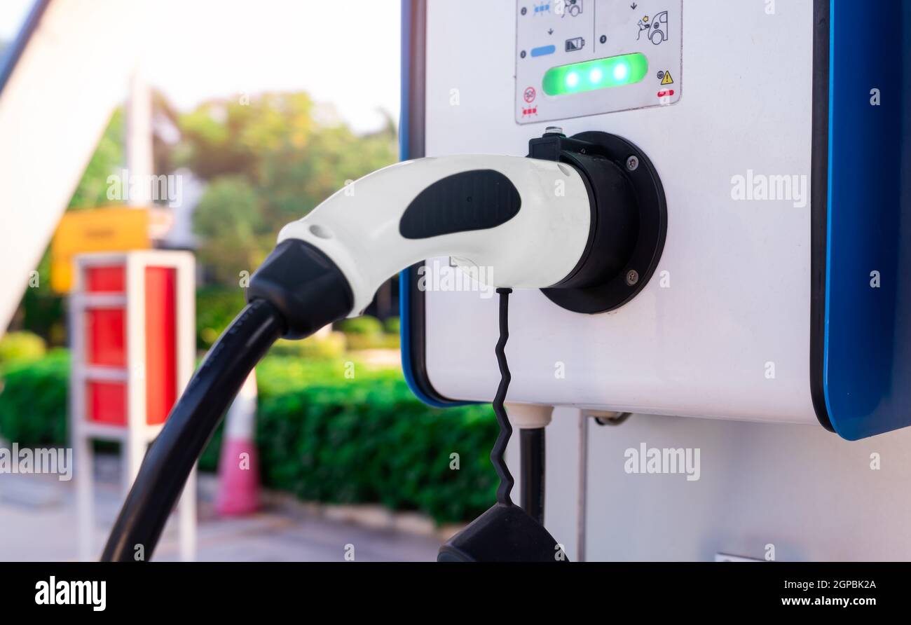Electric car charging station for charge EV battery. Plug for vehicle with electric and hybrid engine. EV charger. Clean energy. Charging point for EV Stock Photo