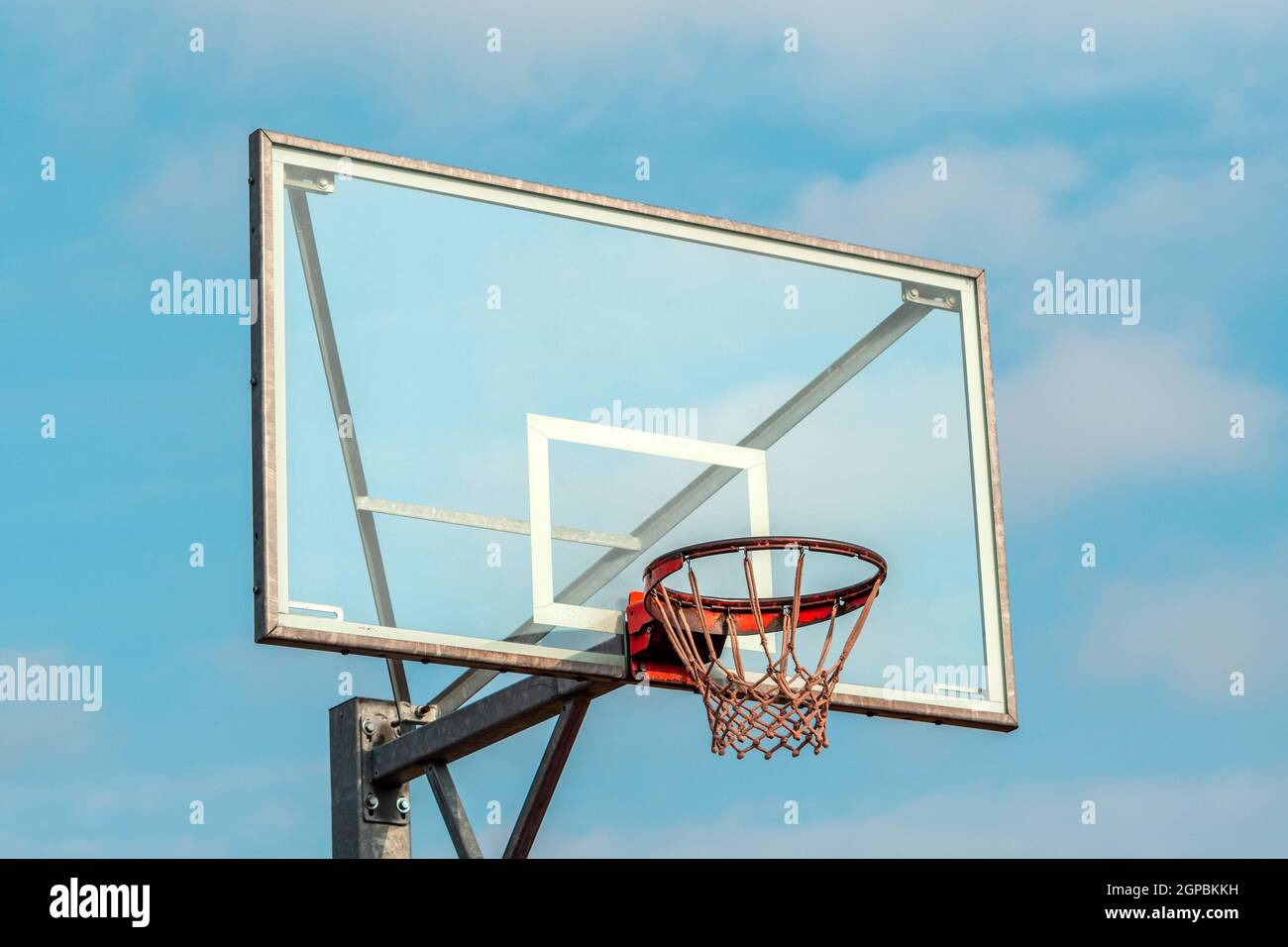 Basketball Net System with rim in front of blue sky background Stock Photo Alamy
